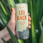 A can of Lei Back Pomelo Sparkling water in someone's hand
